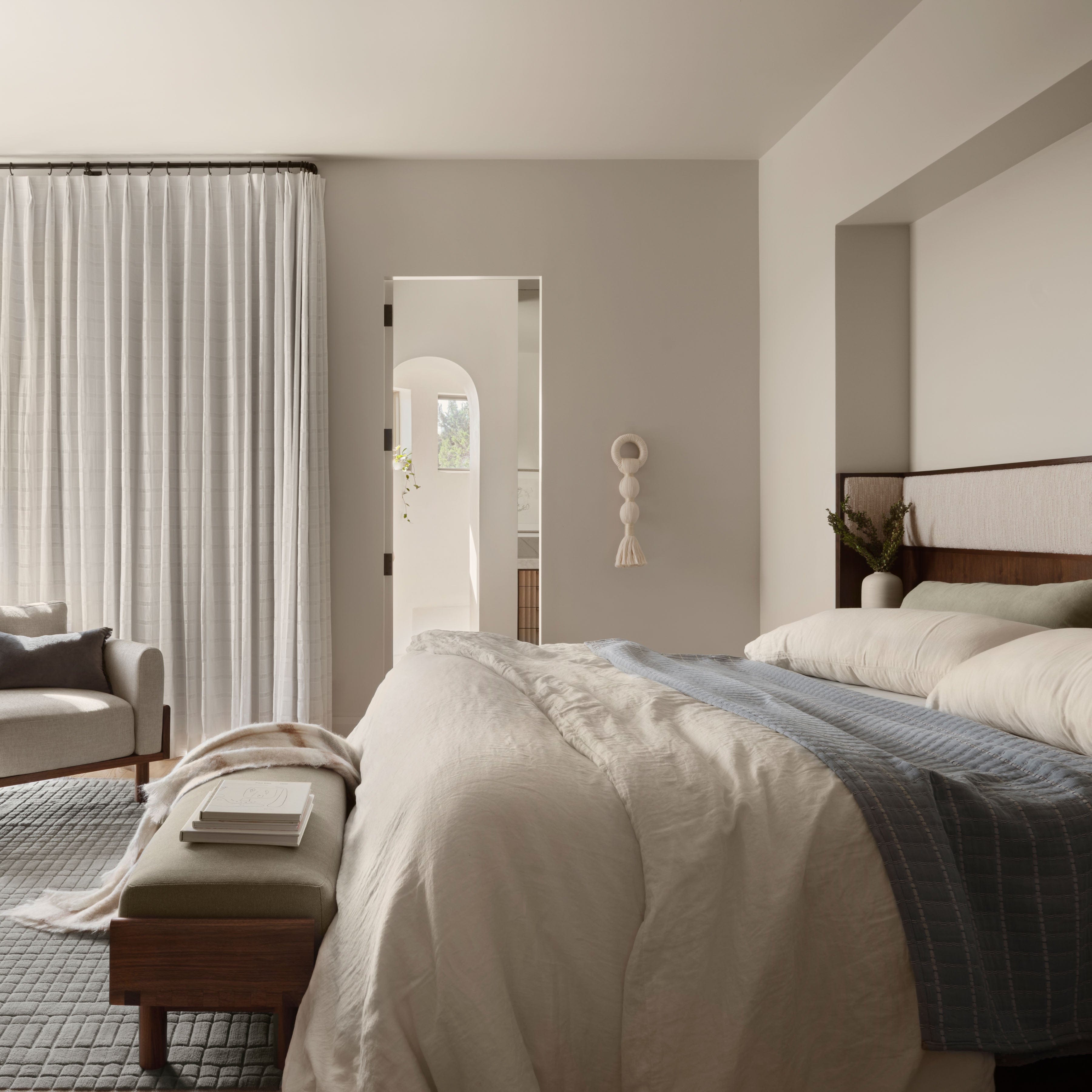 Warm and welcoming bedroom textile styling